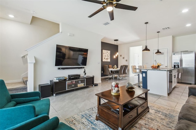 tiled living room featuring ceiling fan