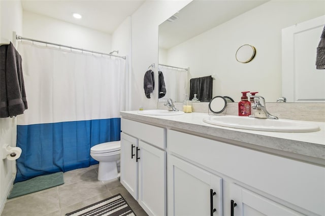 bathroom with vanity, tile patterned floors, toilet, and a shower with shower curtain