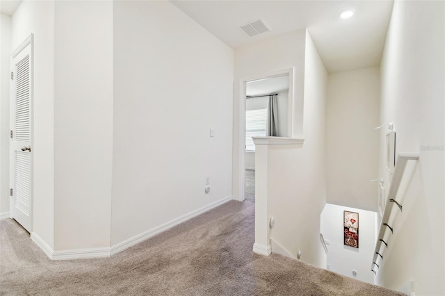 interior space featuring light colored carpet