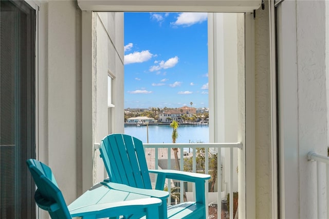 balcony featuring a water view