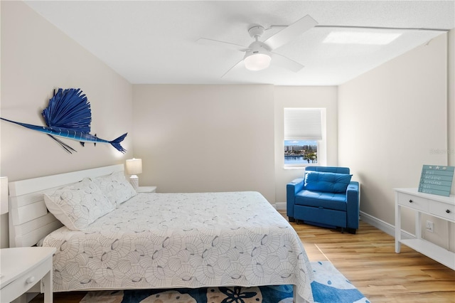 bedroom featuring light hardwood / wood-style flooring and ceiling fan