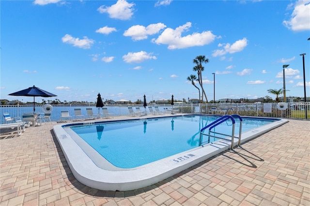 view of swimming pool with a patio