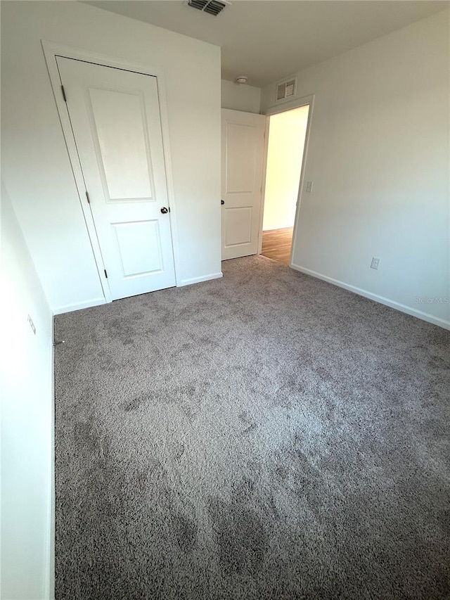 unfurnished bedroom with carpet floors