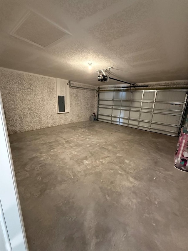 garage featuring a garage door opener and electric panel