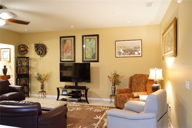 living room featuring ceiling fan and light tile patterned flooring