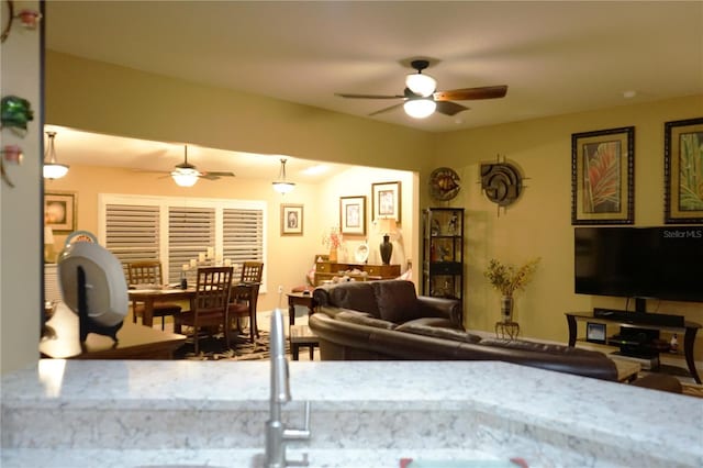 living room with ceiling fan