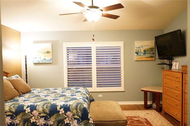 bedroom with light hardwood / wood-style flooring and ceiling fan