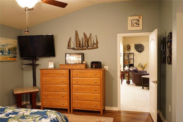 bedroom with hardwood / wood-style flooring and vaulted ceiling