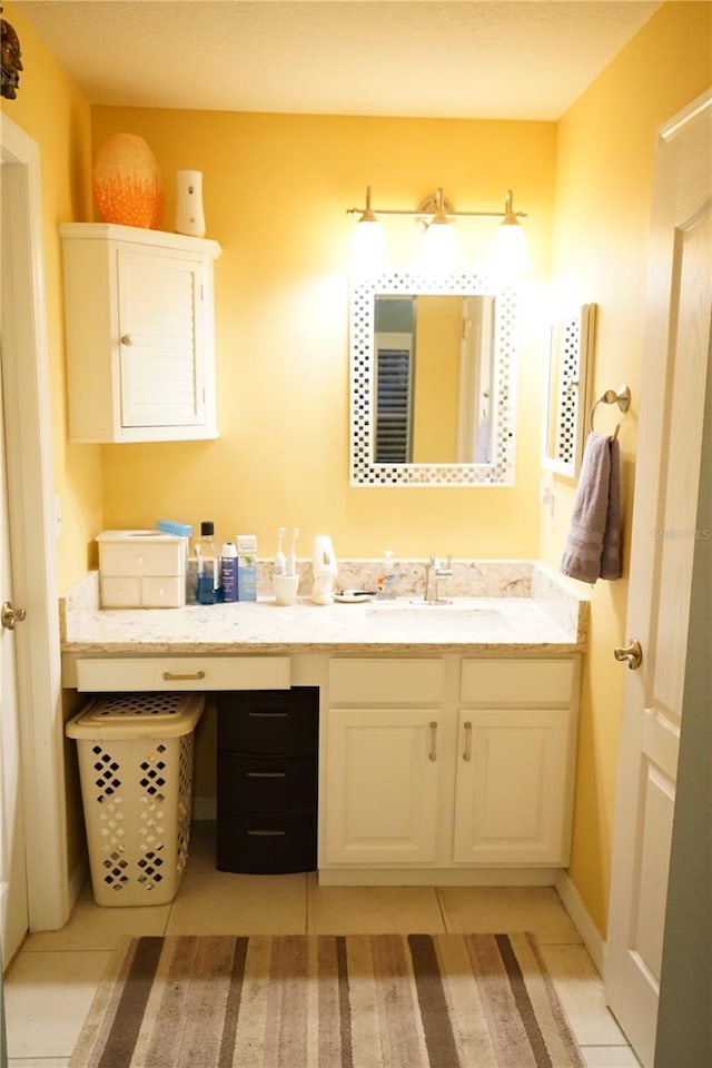 bathroom with tile patterned floors and vanity