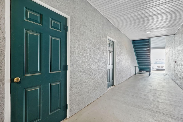 property entrance with stucco siding