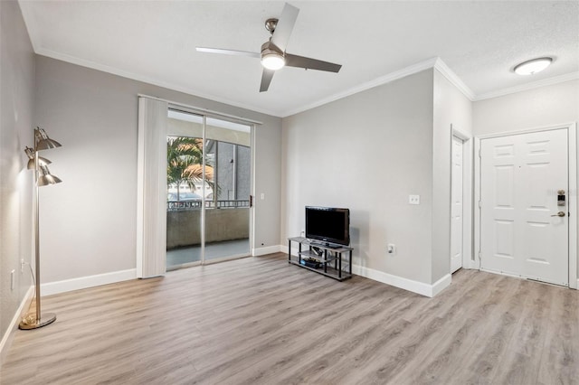 unfurnished living room with light wood-style floors, ornamental molding, baseboards, and ceiling fan