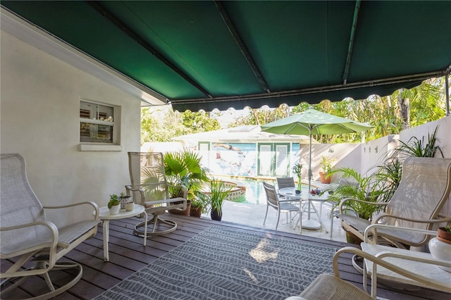 balcony with outdoor dining area