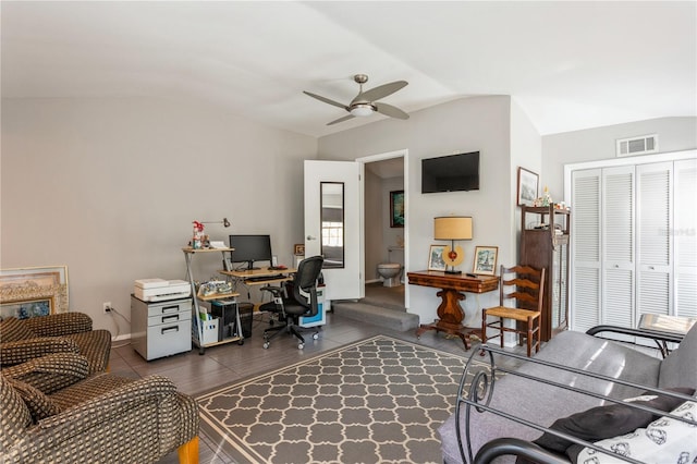 office space featuring a ceiling fan, visible vents, and vaulted ceiling