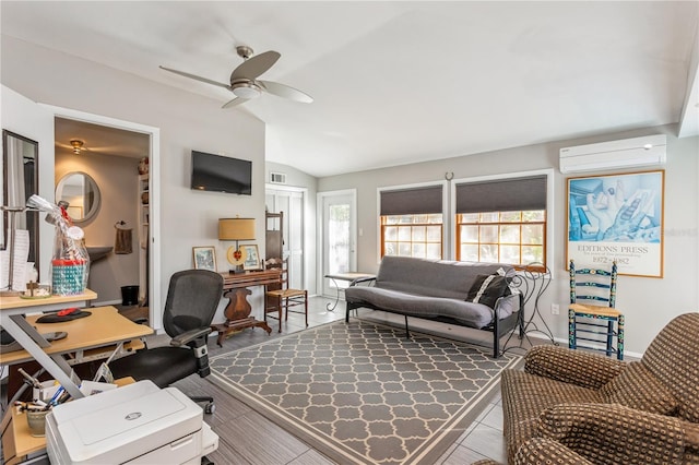 office space with a wall unit AC, visible vents, a ceiling fan, vaulted ceiling, and baseboards