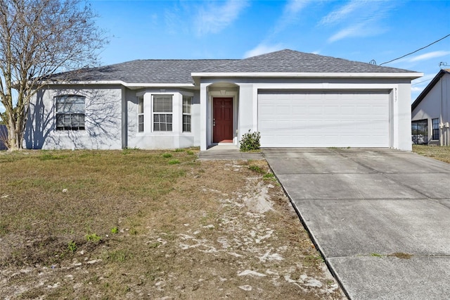 ranch-style home with a garage and a front yard