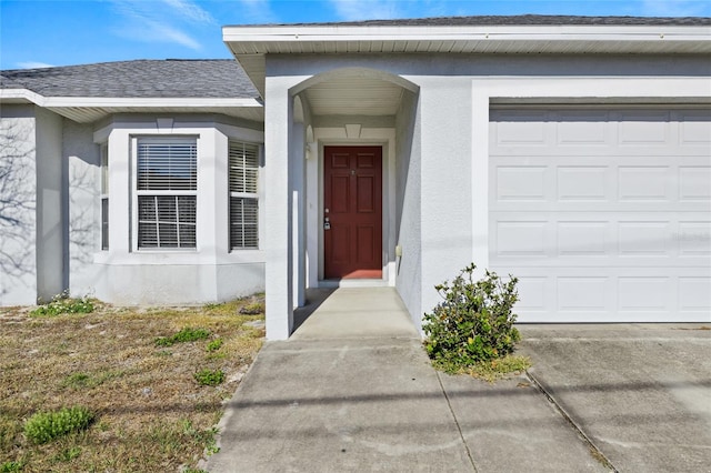 view of exterior entry featuring a garage