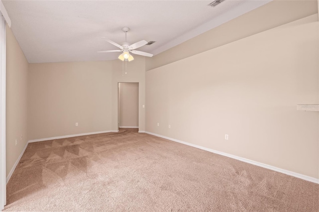 spare room with light carpet and ceiling fan