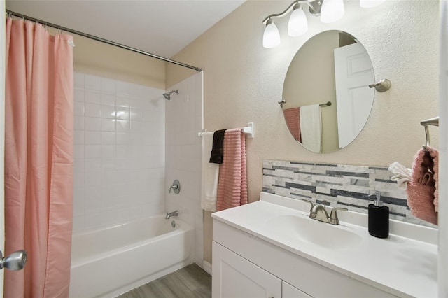 bathroom featuring shower / bath combination with curtain, vanity, tasteful backsplash, and hardwood / wood-style flooring