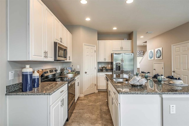 kitchen with white cabinetry, appliances with stainless steel finishes, and sink