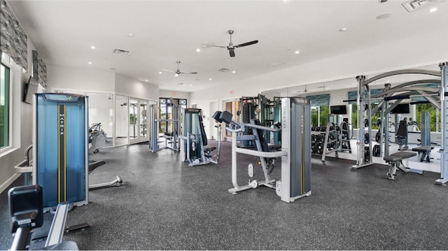 exercise room with ceiling fan and a healthy amount of sunlight