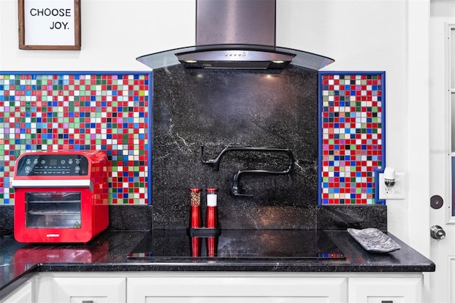 kitchen featuring white cabinets, sink, and island exhaust hood