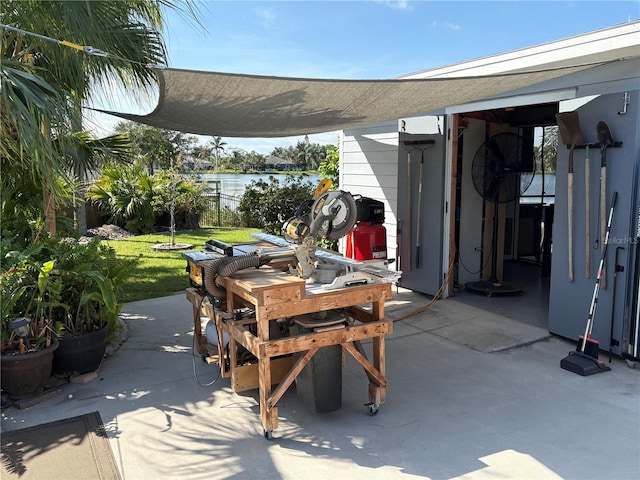 view of patio featuring a water view