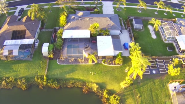 birds eye view of property with a water view