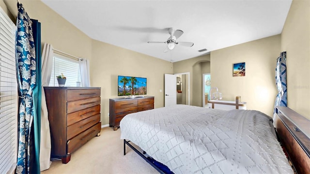 bedroom with ceiling fan and light colored carpet