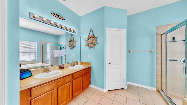 bathroom featuring vanity, shower with separate bathtub, and tile patterned flooring