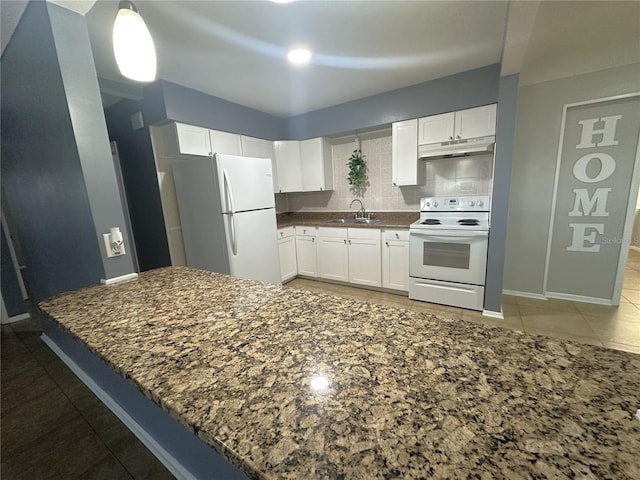 kitchen with sink, white appliances, backsplash, white cabinets, and kitchen peninsula