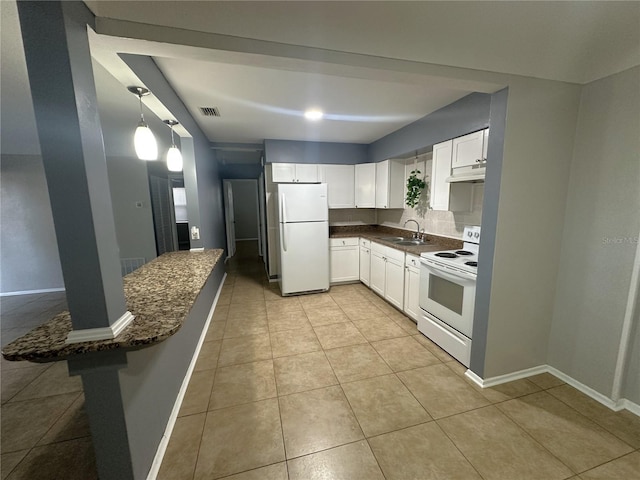 kitchen featuring pendant lighting, sink, white appliances, dark stone countertops, and white cabinets