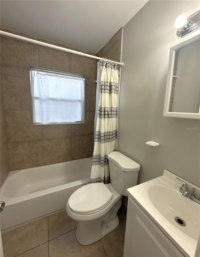 full bathroom featuring vanity, tile patterned floors, toilet, and shower / tub combo with curtain