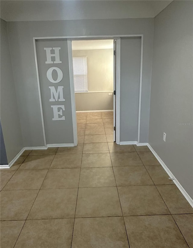 hallway with light tile patterned floors