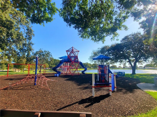 view of jungle gym with a water view