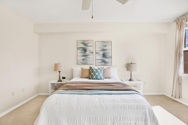 bedroom featuring light colored carpet and ceiling fan