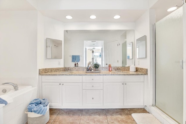 bathroom with vanity, separate shower and tub, tile patterned floors, and ceiling fan