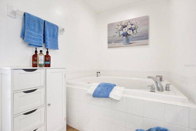 bathroom featuring a relaxing tiled tub