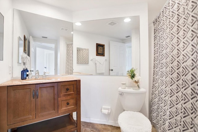 bathroom with vanity, a shower with curtain, and toilet