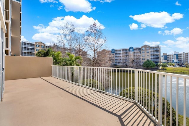 balcony featuring a water view