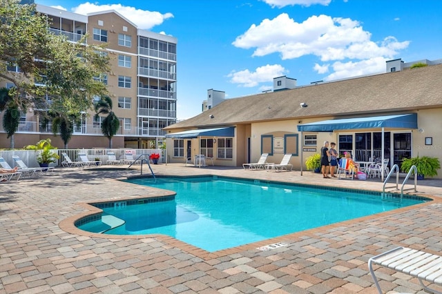 view of swimming pool featuring a patio area