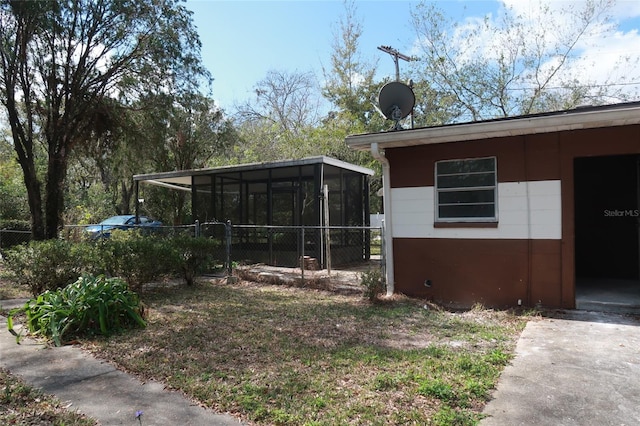 view of yard featuring a sunroom