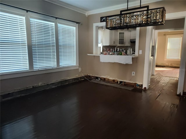 interior space featuring hardwood / wood-style flooring and ornamental molding