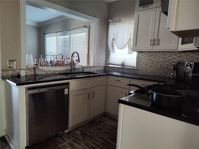 kitchen with dishwasher, sink, white cabinets, and kitchen peninsula