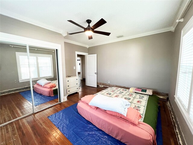 14124 Plum Ln, Hudson, FL 34667 - bedroom with hardwood / wood-style flooring, crown molding, a ceiling fan, a closet, and baseboards