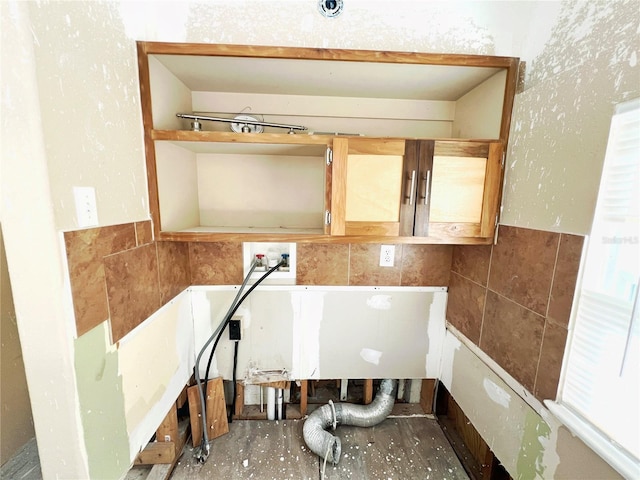 14124 Plum Ln, Hudson, FL 34667 - bathroom with tile walls and wainscoting