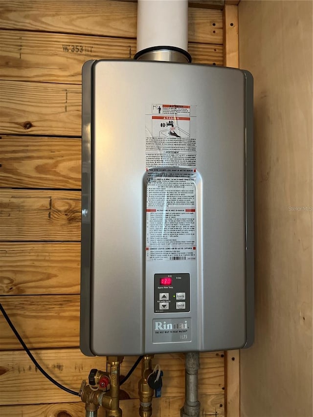 14124 Plum Ln, Hudson, FL 34667 - utility room with water heater