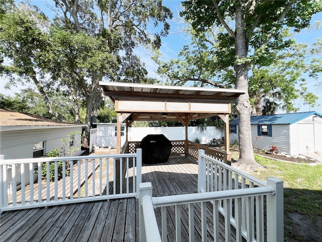 14124 Plum Ln, Hudson, FL 34667 - deck with a gazebo, a fenced backyard, and a grill