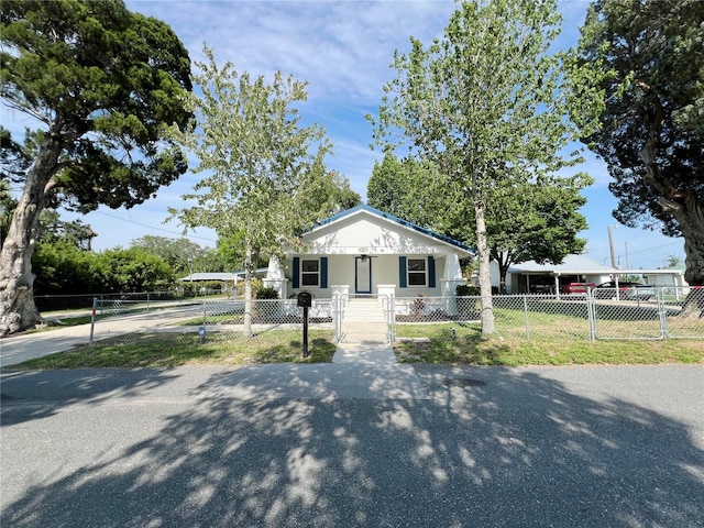 14124 Plum Ln, Hudson, FL 34667 - view of front of home with a gate and a fenced front yard
