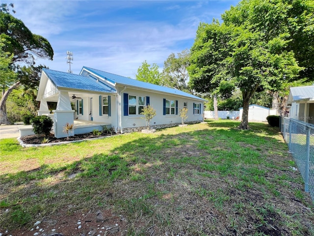 14124 Plum Ln, Hudson, FL 34667 - back of house featuring metal roof and covered porch