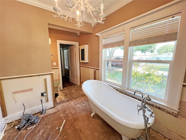 14124 Plum Ln, Hudson, FL 34667 - full bathroom featuring a chandelier, crown molding, and a freestanding bath